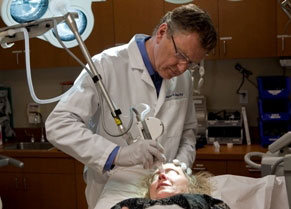 Dermatologist Dr. Christopher Zachary performs a laser procedure on a patient at UC Irvine. 